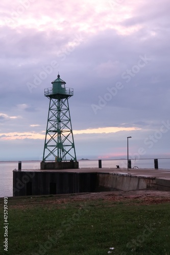 Dramatic sunset view of the lighthouse on the pier Geestemole in Bremerhaven (Germany)