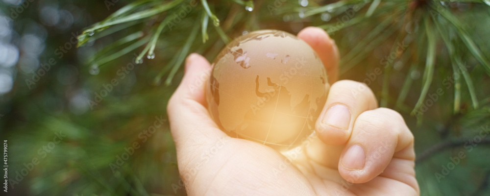 World earth day. Hands are holding a glass planet. World earth day. Hands are holding a glass planet.