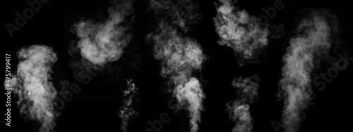 White smoke collection on black background. Fog or smoke set isolated on black background. White mist or smog background.