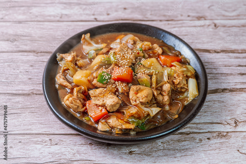 Andongjjimdak, Andong-style spicy stewed chicken : Originally from the Andong region, this dish consists of chicken, chili peppers, potatoes, clear noodles, leeks and carrots braised in a spicy sauce Andongjjimdak, Andong-style spicy stewed chicken : Originally from the Andong region, this dish consists of chicken, chili peppers, potatoes, clear noodles, leeks and carrots braised in a spicy sauce