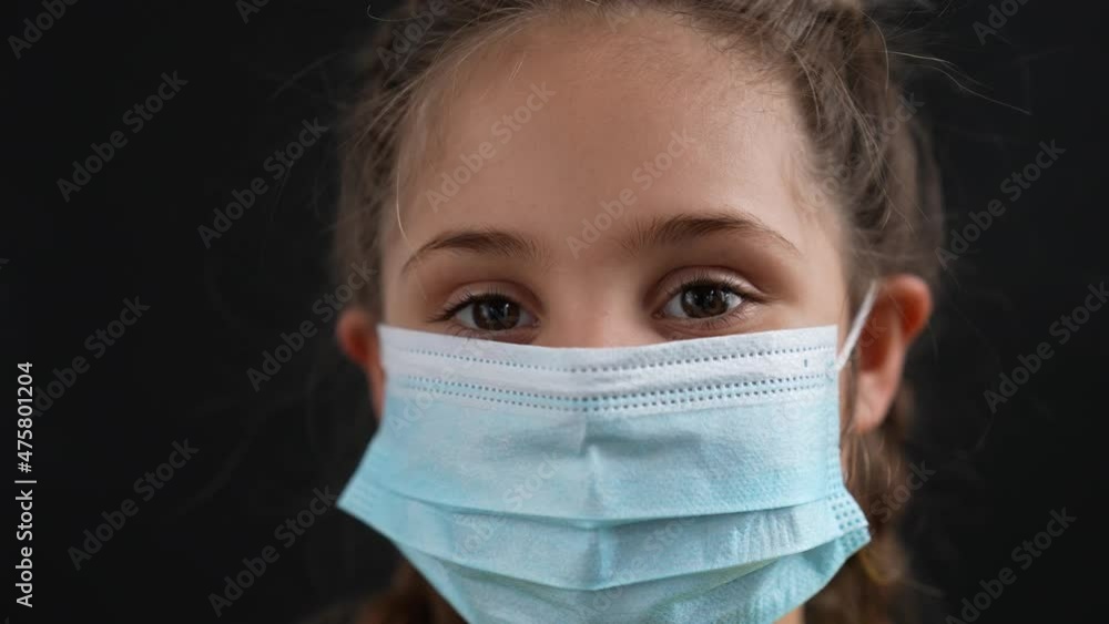Girl in protective mask. Child face in safety mask. Prevention of diseases by virus. Portrait of girl in protective mask. Schoolgirl in medical mask. Close-up of child face. Fighting virus at school Girl in protective mask. Child face in safety mask. Prevention of diseases by virus. Portrait of girl in protective mask. Schoolgirl in medical mask. Close-up of child face. Fighting virus at school