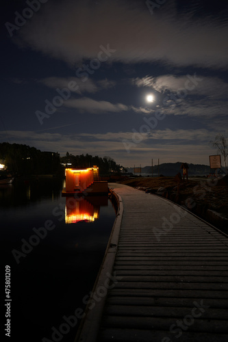 Lysaker Brygge by night. Long exposure to smooth out the water and to capture the dark parts without noise. Shot at Oslo, Norway, from the Bygdøy side Sollerud boat building.  photo