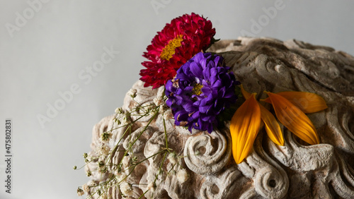 Statue of Alexander the great ornamented with colorful flowers