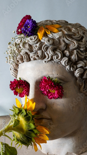 Statue of Alexander the great ornamented with colorful flowers