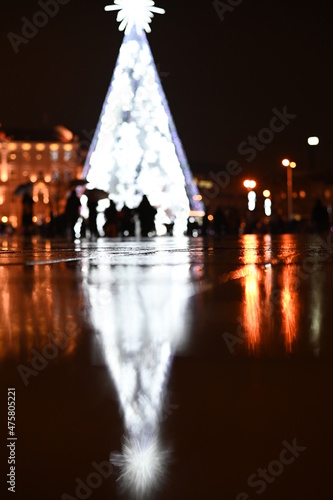 Vilnius, Lithuania 12-11-2021 Rainy winter evening in the cathedral square of the vilnius christmas tree in the capital of lithuania. Trip to Vilnius during Christmas, the most beautiful time.