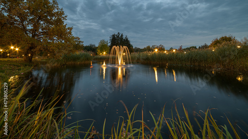Šilutė manor park, wonderfully arranged and prepared park. fountain in the park to create coziness, fountain photographed at night with long exposure, silky water. Amazing beautiful fountain at night.