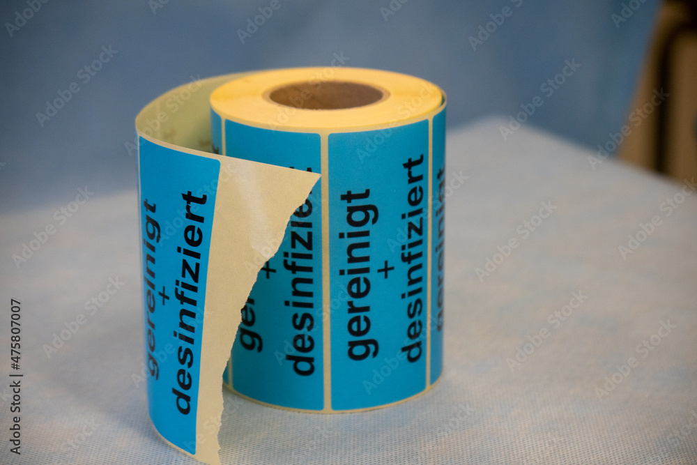 on a roll are stickers with the inscription cleaned+disinfected on a roll are stickers with the inscription cleaned+disinfected