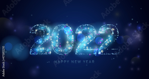 Happy New Year 2022. Abstract light sparking in 2022 shape on bokeh background
