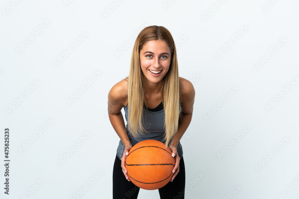 Young student woman isolated on white background playing basketball