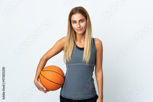Young student woman isolated on white background playing basketball