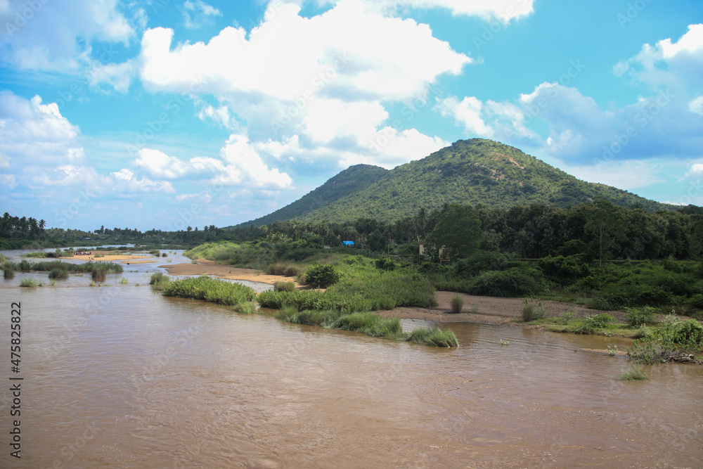 Greenish Landscape with mountain, river and clouds in south India, Tamil Nadu state, Dindigul district