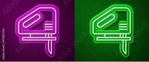 Glowing neon line Electric jigsaw with steel sharp blade icon isolated on purple and green background. Power tool for woodwork. Vector