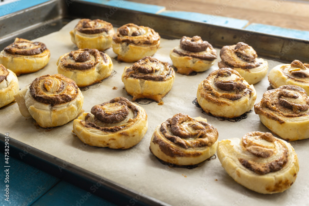 Puff Pastry Pinwheels stuffed with chocolate on a wooden board