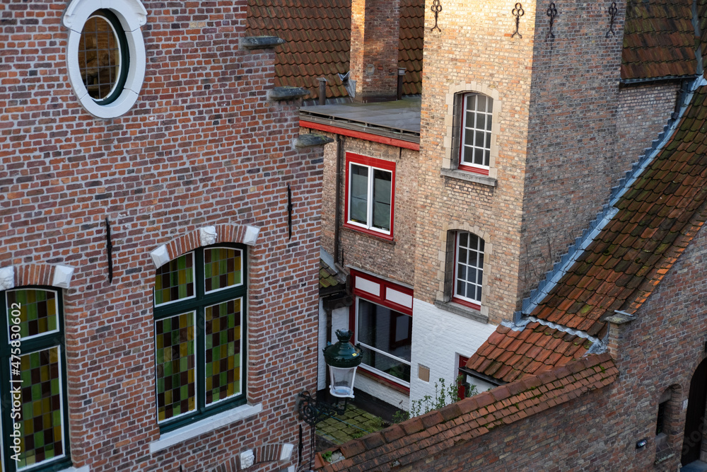 red facades of buildings in Bruges