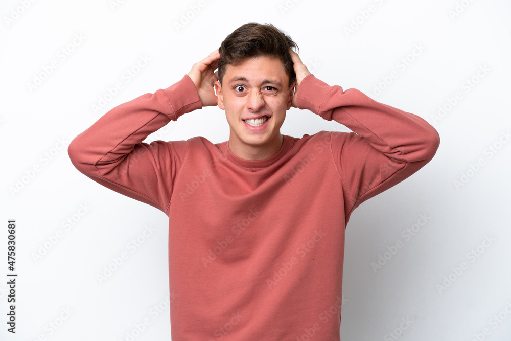 Young handsome Brazilian man isolated on white background doing nervous gesture Young handsome Brazilian man isolated on white background doing nervous gesture