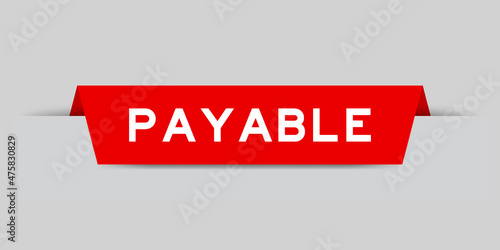Red color inserted label with word payable on gray background