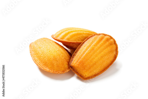 Perfect French madeleine cookies, buttery and delicate. Isolated on white background.  photo