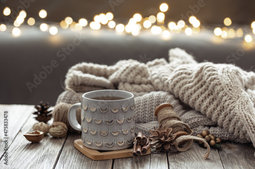 Beautiful christmas cup and candles on blurred background with bokeh.