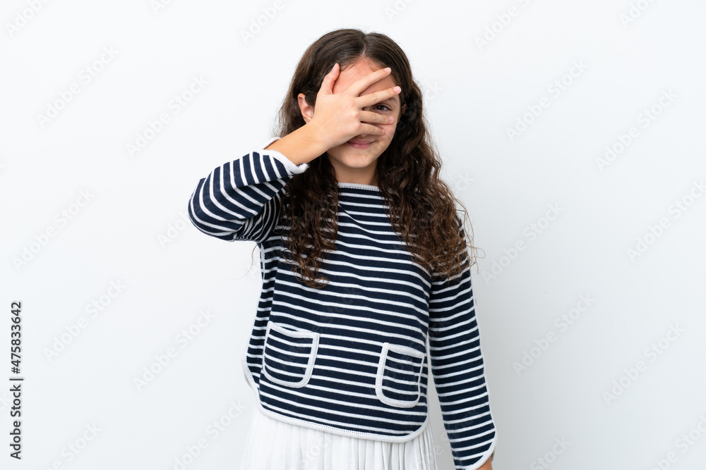 Little caucasian girl isolated on white background covering eyes by hands and smiling Little caucasian girl isolated on white background covering eyes by hands and smiling
