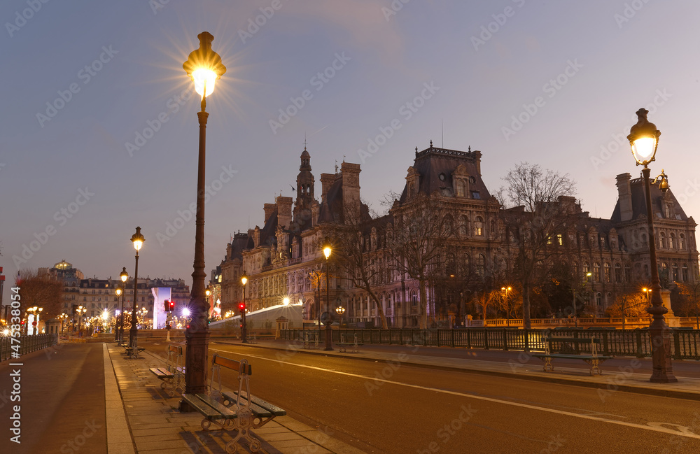 The City Hall of Paris and bridge Arcole across Seine river at night, Paris.