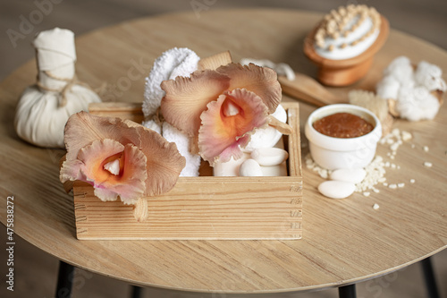 Spa composition with Thai orchid flowers and bath accessories.