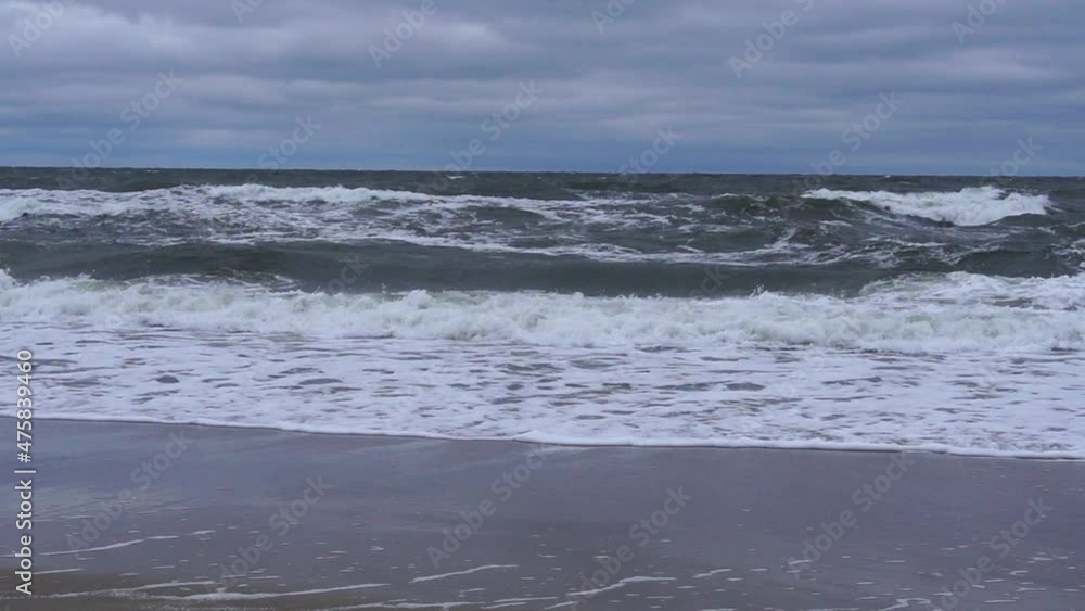 White crests of waves on the shores of the Baltic Sea in Kolobrzeg. White crests of waves on the shores of the Baltic Sea in Kolobrzeg.
