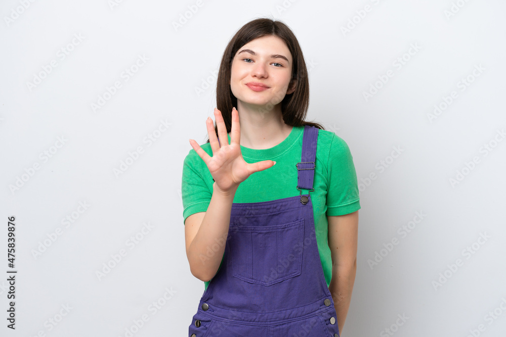 Fototapeta premium Young Russian woman isolated on blue background counting five with fingers