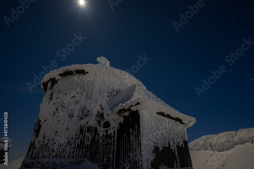 Obraz na płótnie chapel on Snezka mountain at moon winter night in Giant mountains w salonie