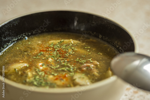 green sorrel soup in dip plate closeup