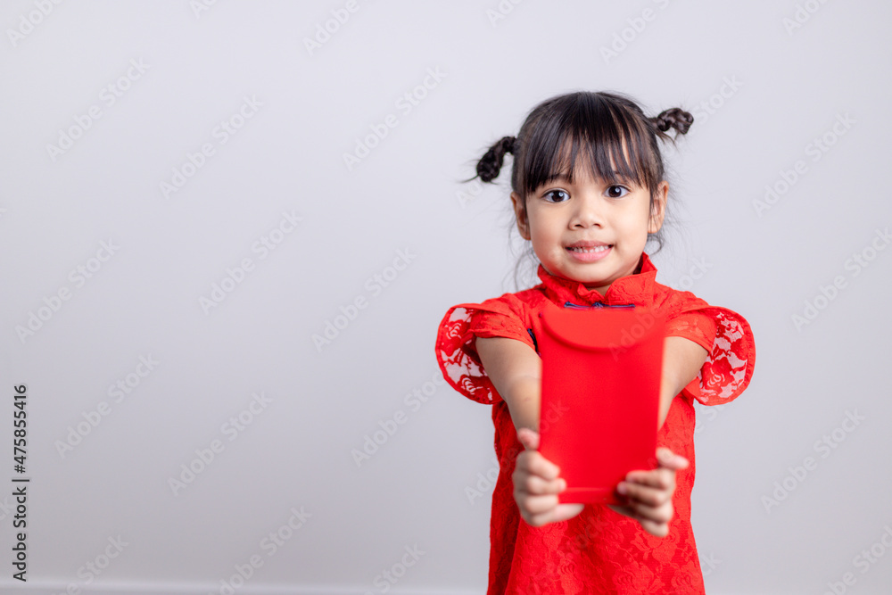 happy Chinese new year. smiling Asian little girls holding red envelope happy Chinese new year. smiling Asian little girls holding red envelope
