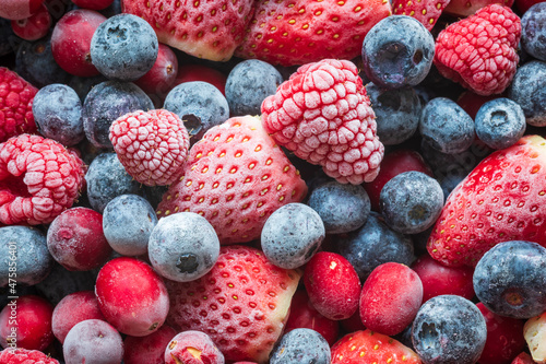 frozen mix strawberries blueberries raspberries and cranberries closeup