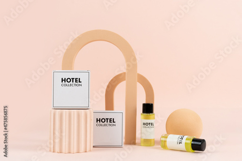 Disposable cosmetics for hotel visitors on geometric podium