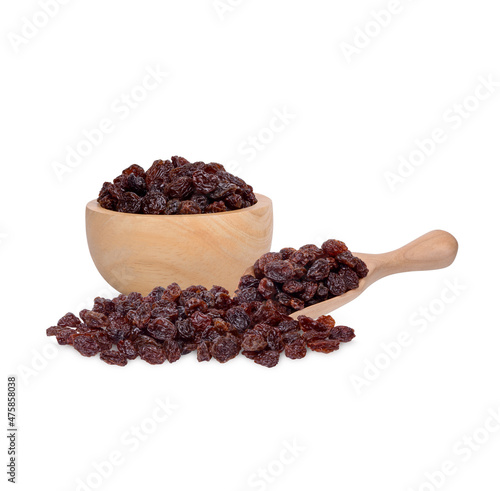Dried raisins in the wooden bowl isolated on white background
