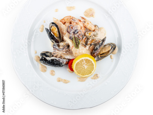 Rice with seafood: shrimp, squid and mussels. Isolated on a white background.