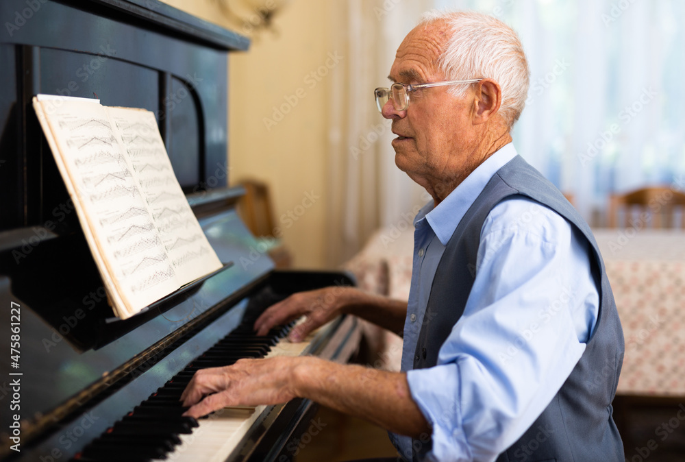 Compositor creating new music with piano at home Compositor creating new music with piano at home