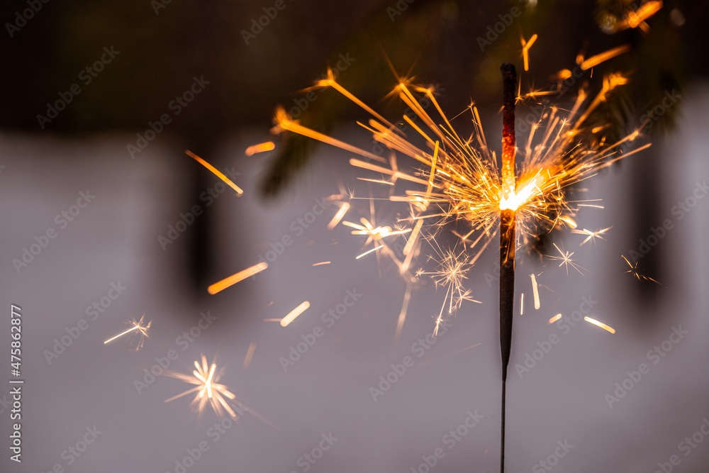 winter background with sparkler, the concept of Christmas and new year