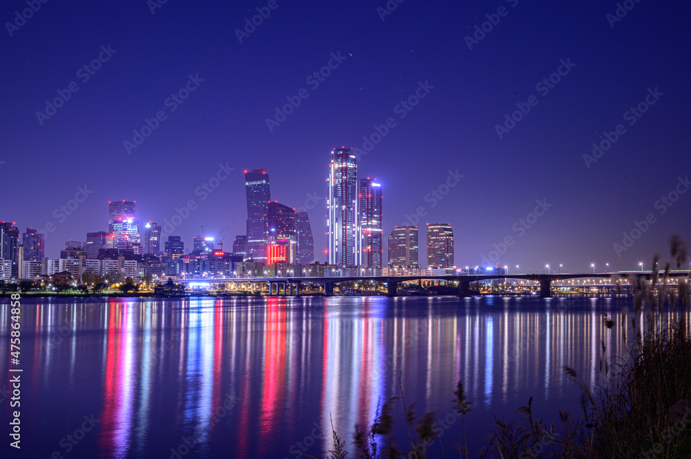 Naklejka premium Cityscape night view of Yeouido, Seoul at sunset time