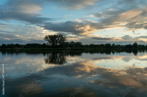 The reflection of the evening clouds in the lake water