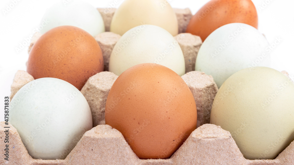 Organic chicken eggs in carton close-up. The concept of a healthy diet with farm products. Eggs as a source of cholesterol as well as protein and vitamins. Organic chicken eggs in carton close-up. The concept of a healthy diet with farm products. Eggs as a source of cholesterol as well as protein and vitamins.