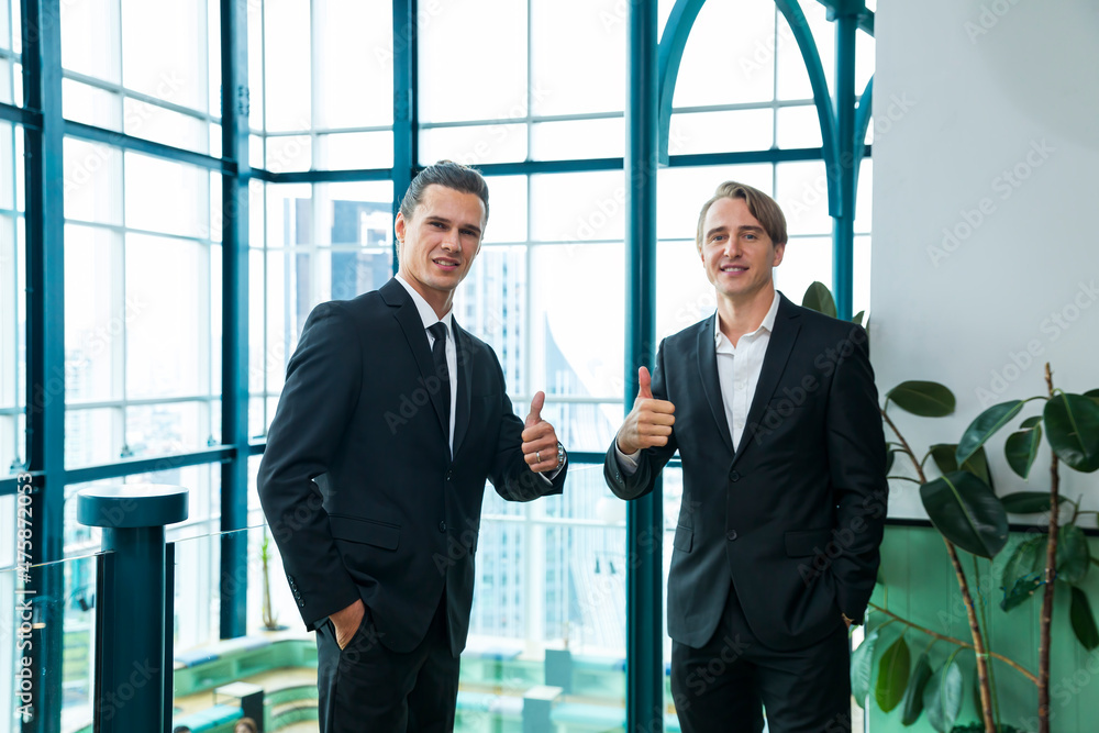 Businessman show thump up. Young businessman with thumb up. Businessman show thump up. Young businessman with thumb up.