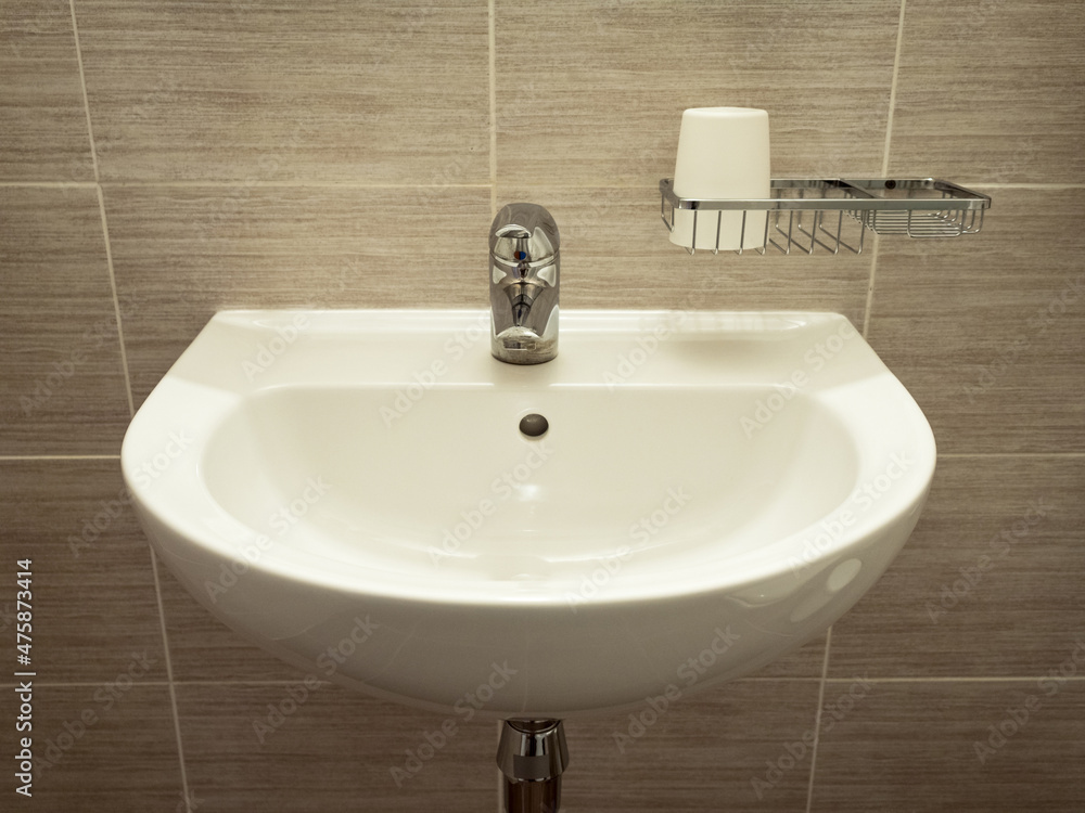 Fototapeta premium White sink on the wall in bathroom