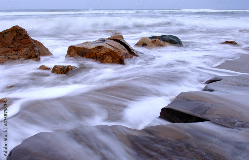 Fototapeta premium Wave washed beach motion.