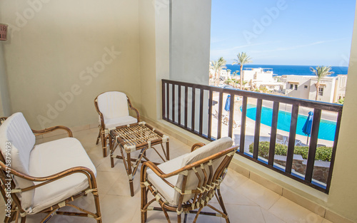 Terrace balcony with chairs in tropical luxury apartment resort