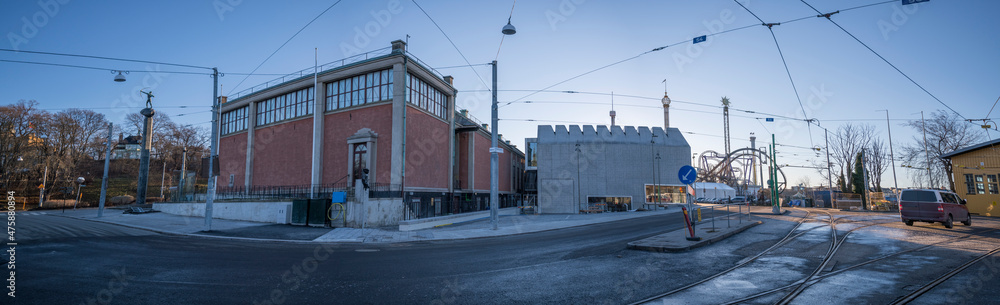 Back light panorama view over art museum and the towers of an amusement park at the tram stables in the island Djurgården a sunny winter day in Stockholm