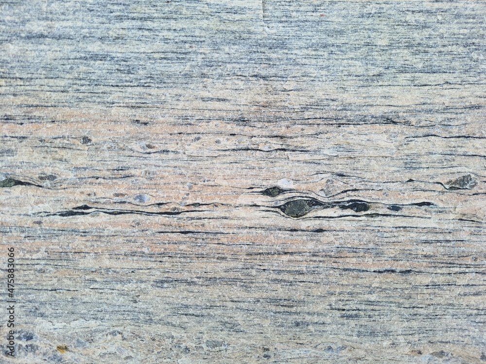 Naklejka premium Background texture and pattern of a granite wall in a quarry in full frame. Close up. macro