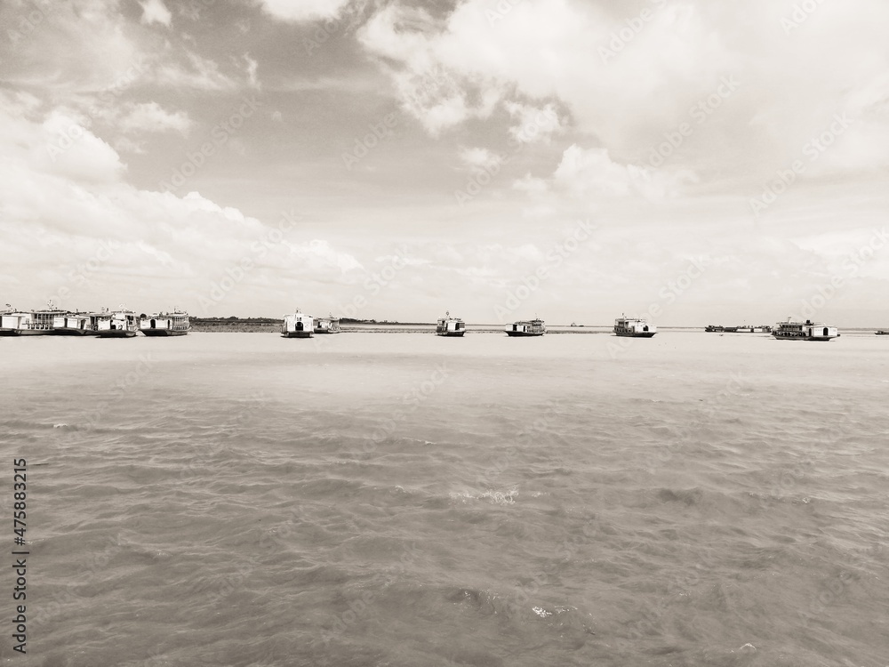 Boats on river in Louhajang besides Dhaka division in Bangladesh. 
