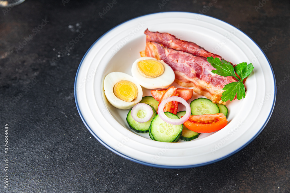 English breakfast eggs, bacon, tomato, cucumber, toast bread healthy meal diet snack on the table copy space food background rustic English breakfast eggs, bacon, tomato, cucumber, toast bread healthy meal diet snack on the table copy space food background rustic