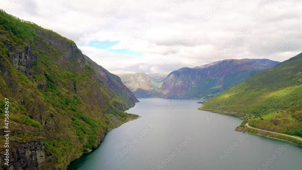 Flying over a stunning Fjord in Norway with lake and Mountains - Pan view Flying over a stunning Fjord in Norway with lake and Mountains - Pan view