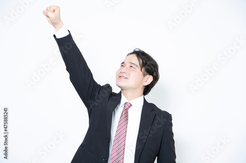 片手をあげているビジネスマン
