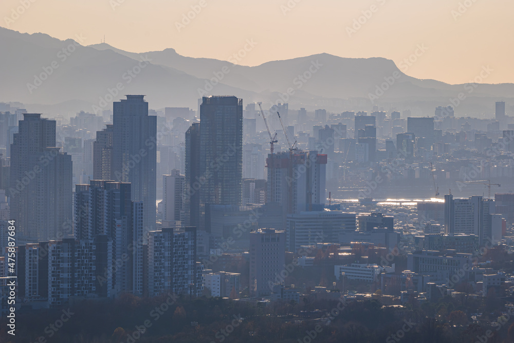 Cityscape of Seoul, South Korea from the top of mountain in the daytime Cityscape of Seoul, South Korea from the top of mountain in the daytime